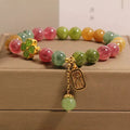 Women's colourful tourmaline bracelet with four-leaf clover charm and pearl pendant on a mixed material electroplated chain.