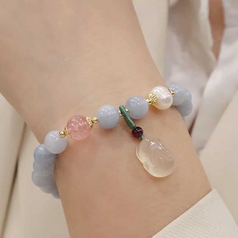 Aquamarine crystal bracelet with gold-plated climbing cat charm for women