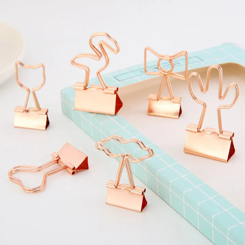 Gold-toned long tail metal office clip with decorative flamingo, love, clouds, cat, cactus, and bow design options.