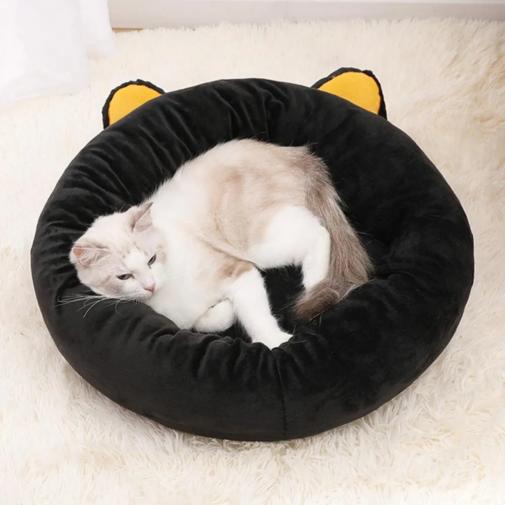 Black cat shaped velvet pet nest bed with raised edges for feline head and neck support