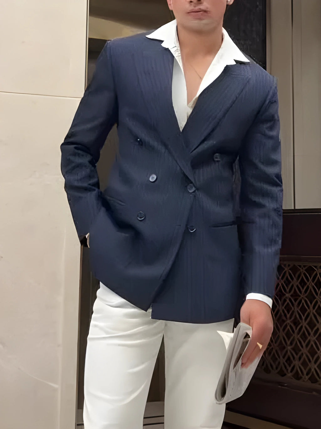 Men's classic striped double-breasted polyester blazer on a hanger, showing regular fit and length.