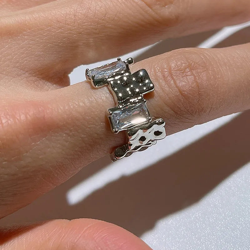 Geometric open design zircon ring in silver-plated metal with retro styling