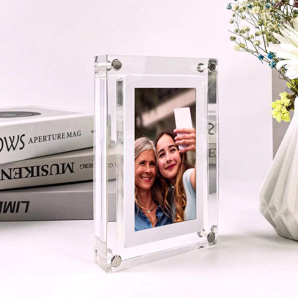 White acrylic digital picture frame with 5 inch vertical screen on a table