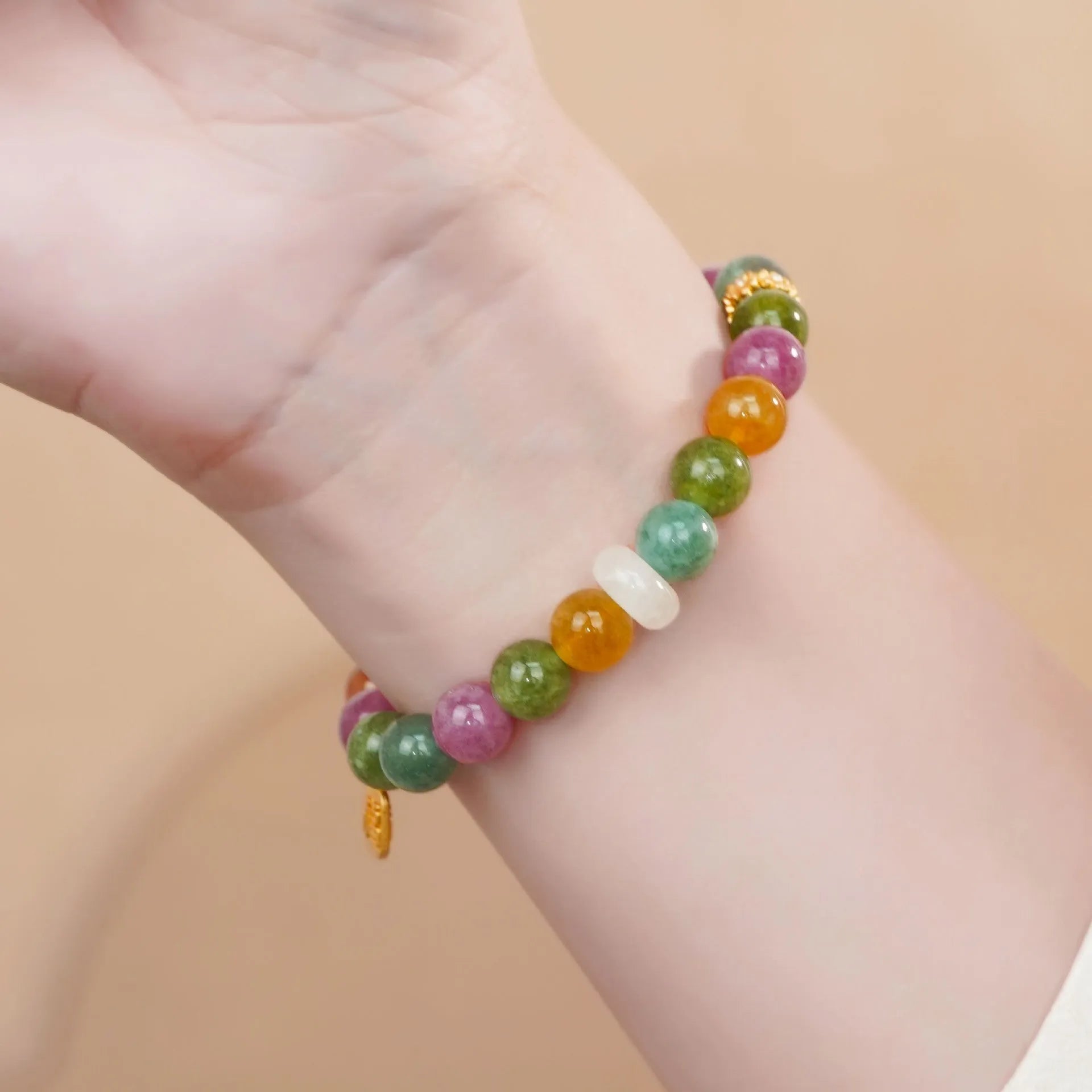 Rainbow coloured tourmaline half bracelet for women with an electroplated finish.