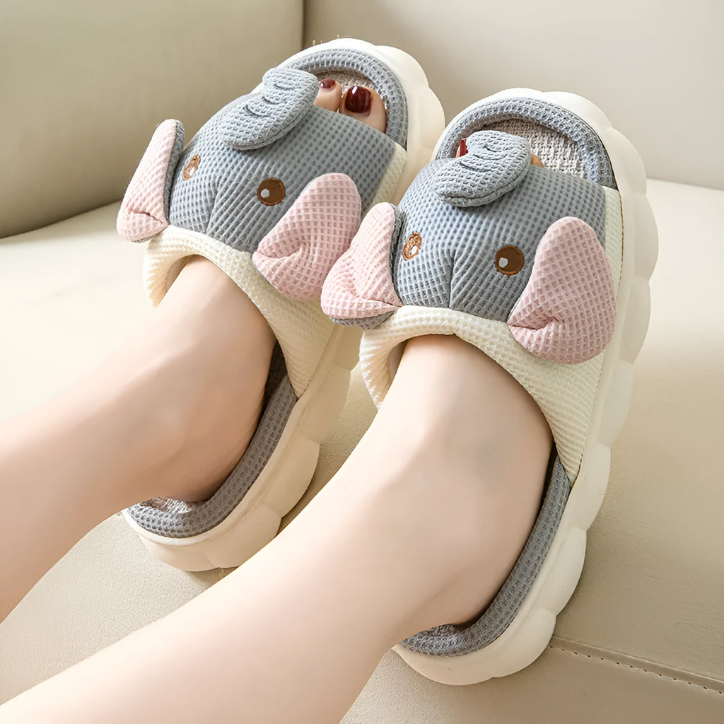 Elephant grey open-toe linen slippers for couples on a plain background, showing sewn sole detail.