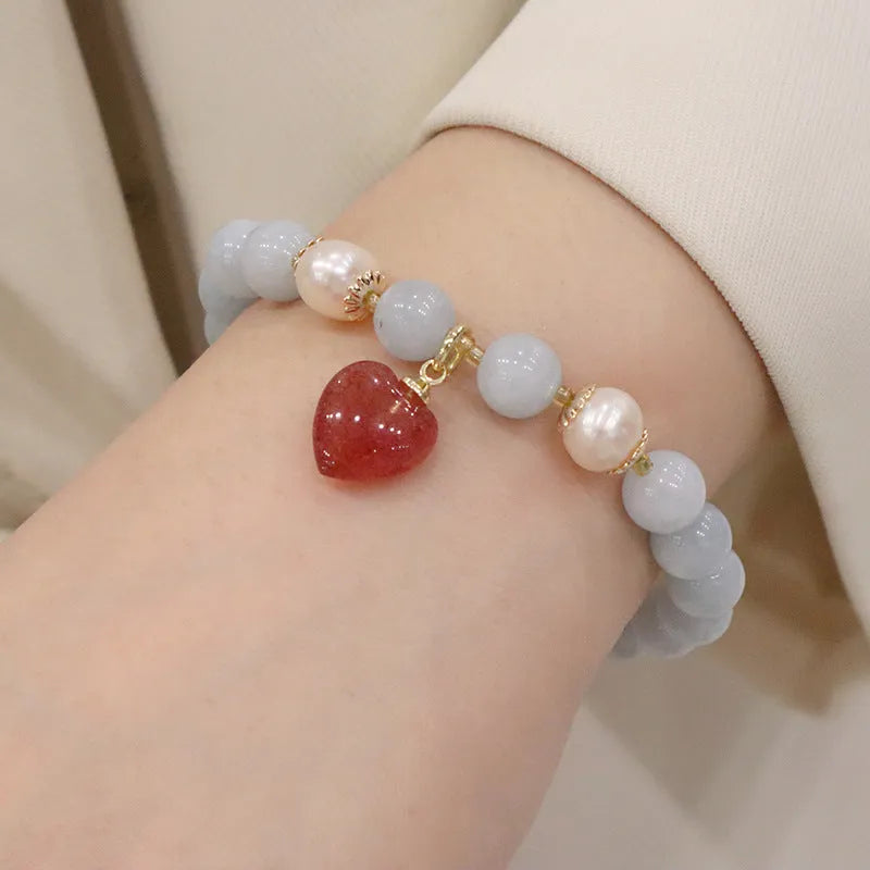 Aquamarine crystal bracelet with gold-plated climbing cat charm for women