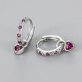 Women's heart-shaped drop earring with a dangling coloured stone, available in gold or white gold plating.