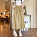 Camel-coloured women's wide leg skirt with elastic waistband, shown on hanger