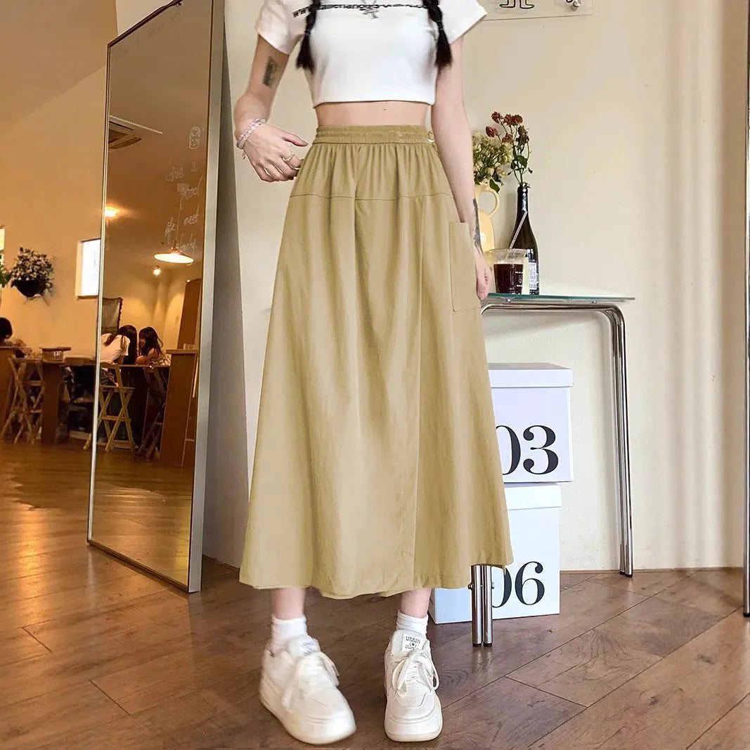 Camel-coloured women's wide leg skirt with elastic waistband, shown on hanger