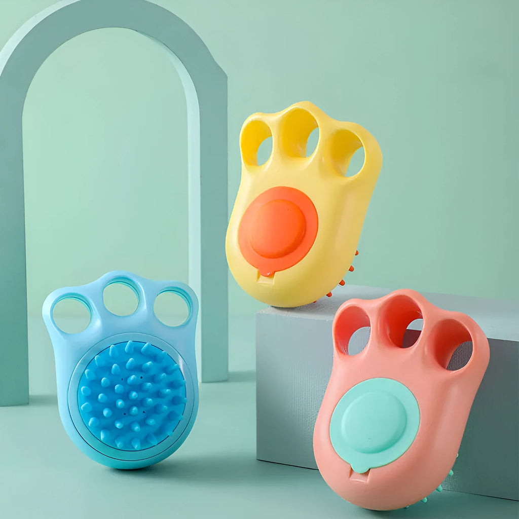 Blue silicone claw pet bath brush with non-slip handle for dog and cat grooming.