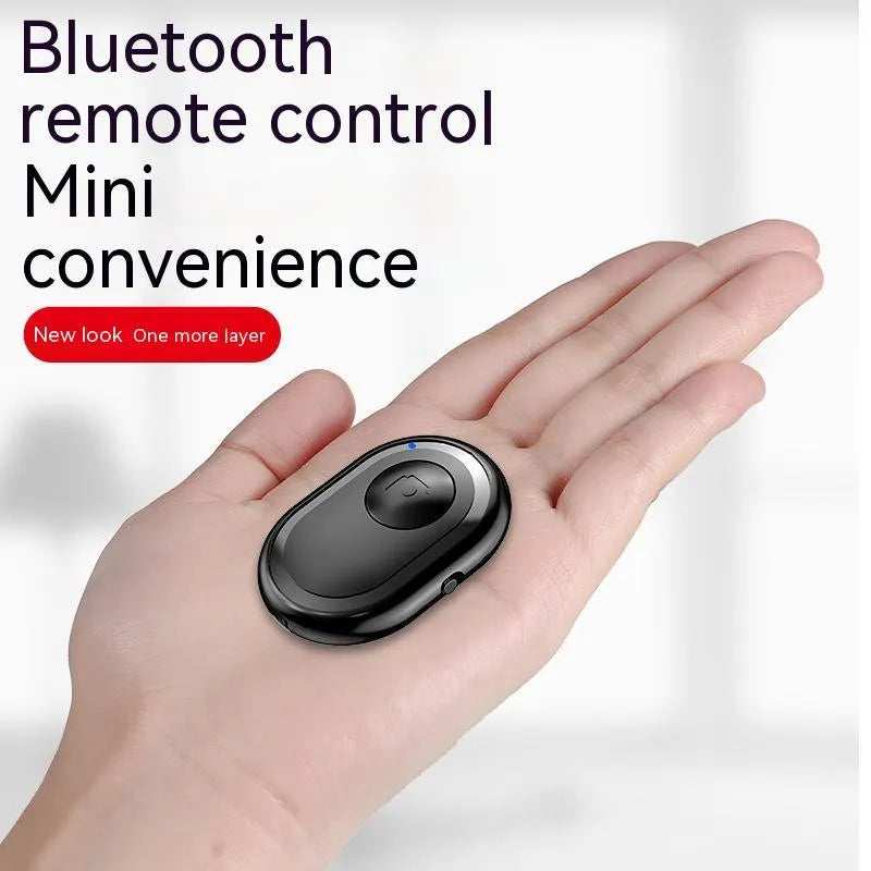 Compact black wireless Bluetooth remote control for smartphone camera photography