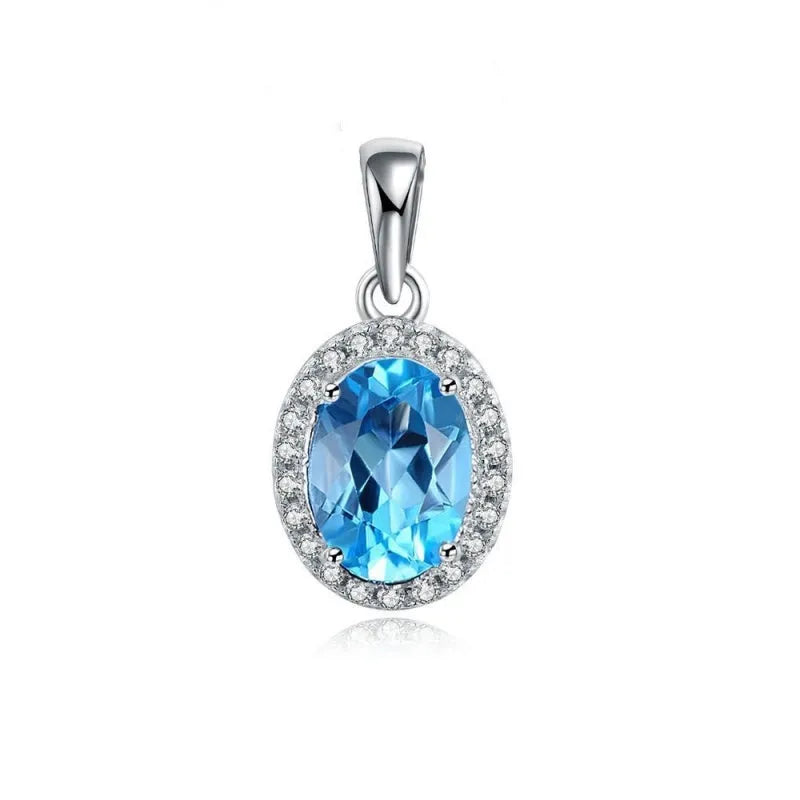925 sterling silver four-piece jewellery set with blue topaz gems showing geometric-designed earrings, ring, pendant, and necklace