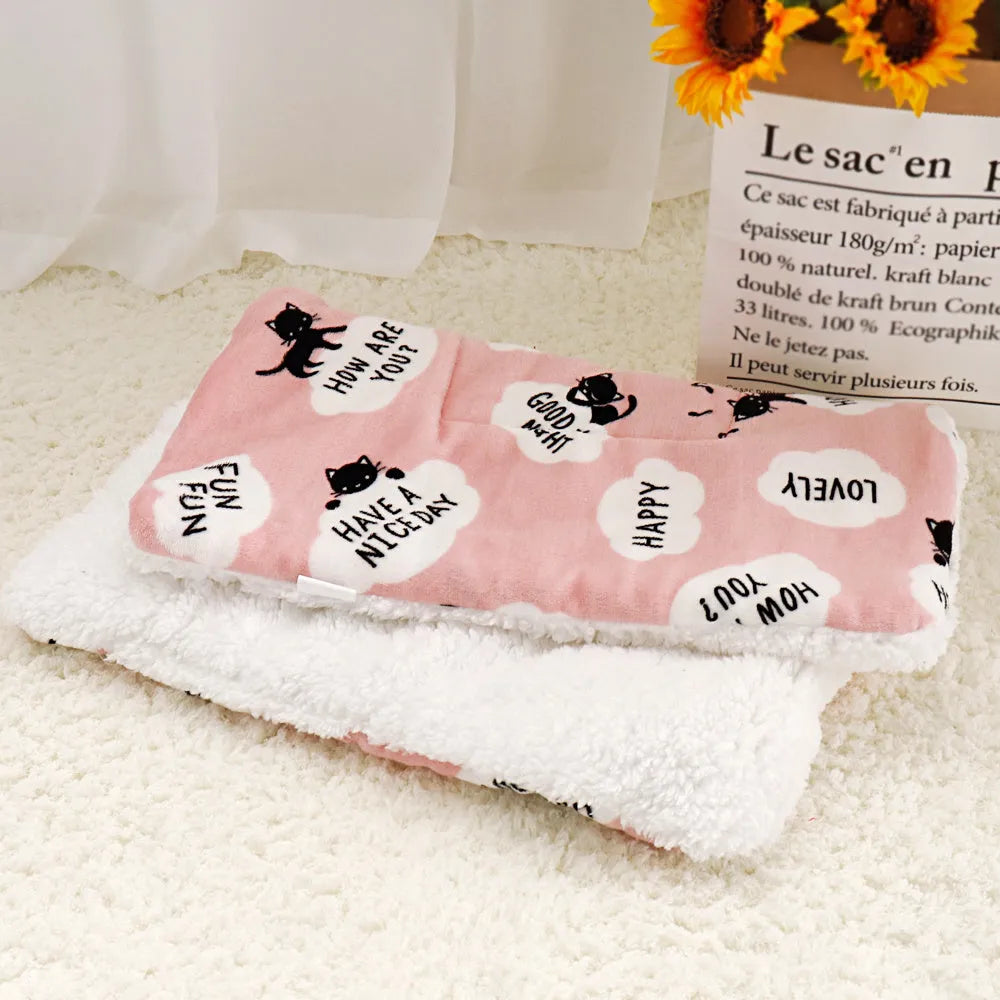 Lambskin pet blanket in flannel cashmere with cute cartoon pattern, grey colour, 55x70cm size on a pet bed