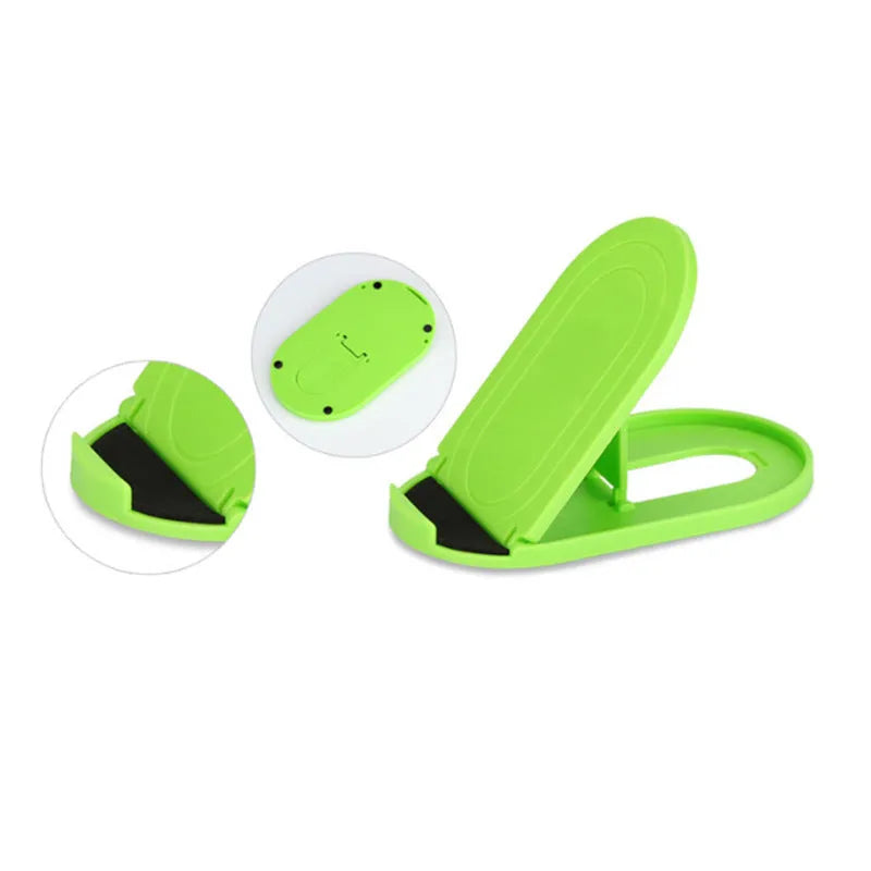 Adjustable plastic mobile phone stand in one of six colour options: black, blue, grey, pink, white, or yellow.