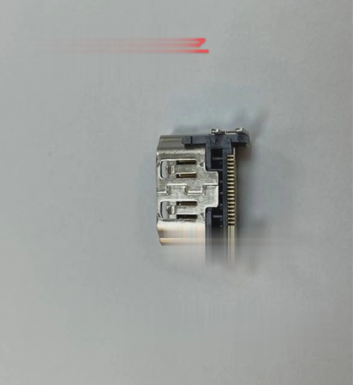 Silver HDMI host interface socket for game console repair and signal connectivity.