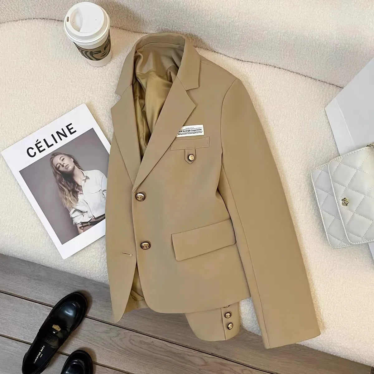 Black women's loose-fit short suit coat with regular sleeves and pockets