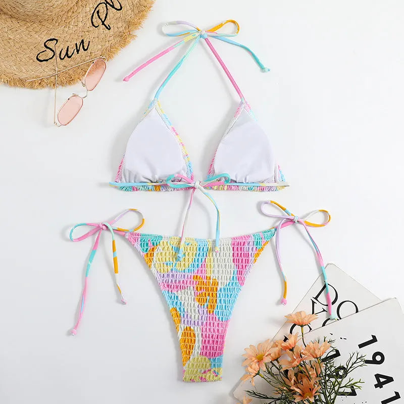 Women's multicolour floral triangle bag bikini swimsuit with split printed design and smocking craft detail.