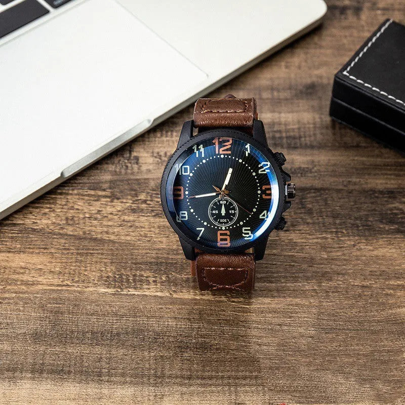 Men's gift set with brown leather watch, sunglasses, pen, and cufflinks in a gift box