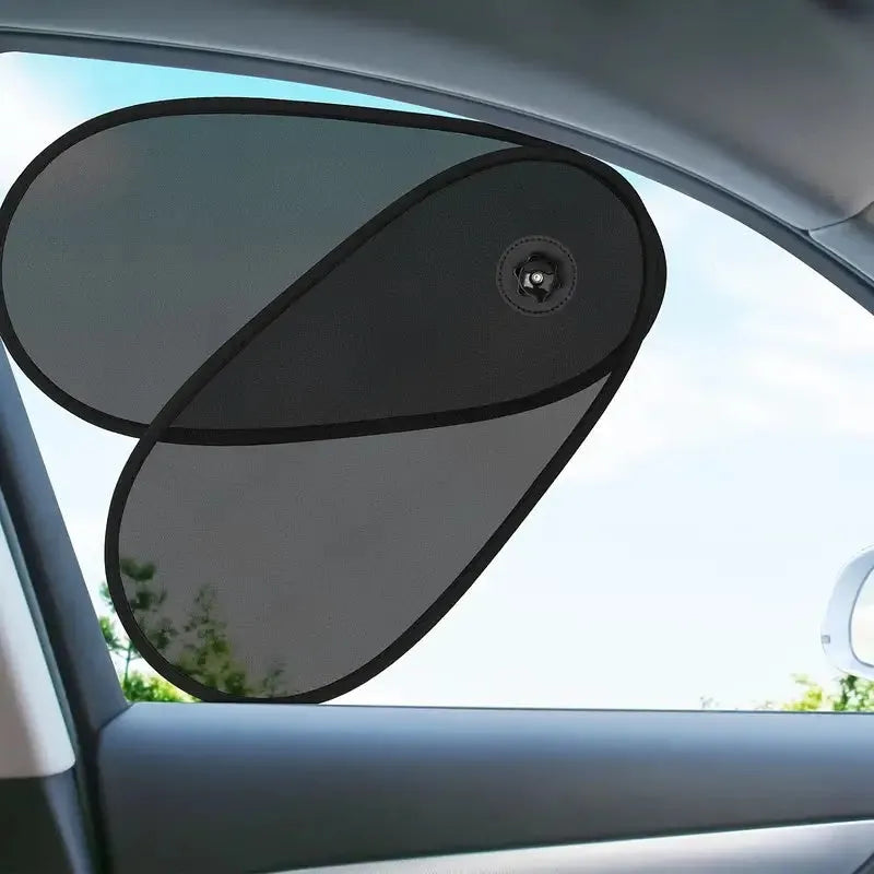 Black stretchy car side window shade with suction cups installed on a car window.