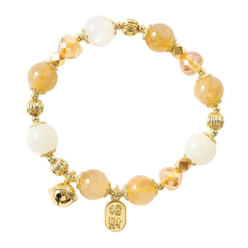 Korean style gold bracelet with rutilated quartz crystal charms on an electroplated chain.