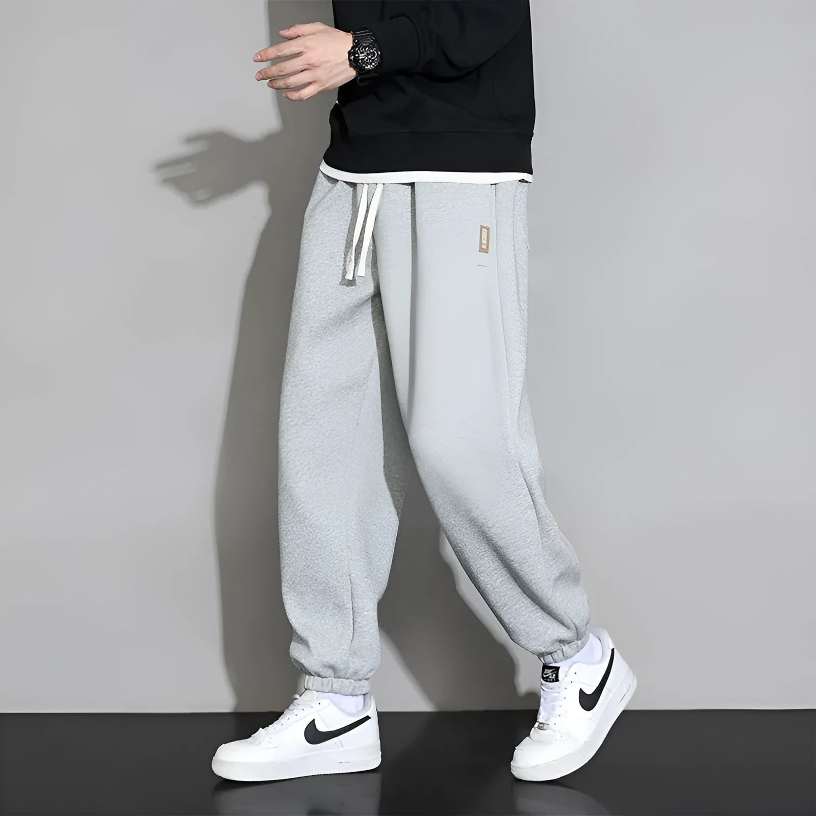 Men's loose fit casual sports trousers in gray, black, or army green with drawstring waist