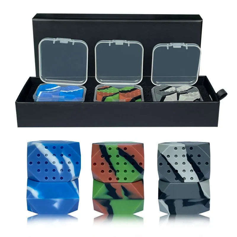 Two camouflage silicone facial muscle fitness balls for jaw training in a transparent box.