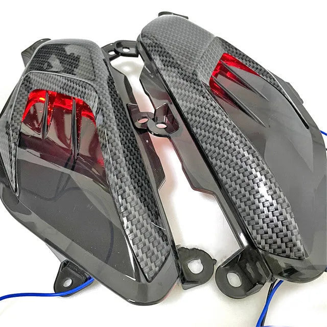 Pair of YAMAHA NMAX carbon fibre style LED side lamps in blue or red.