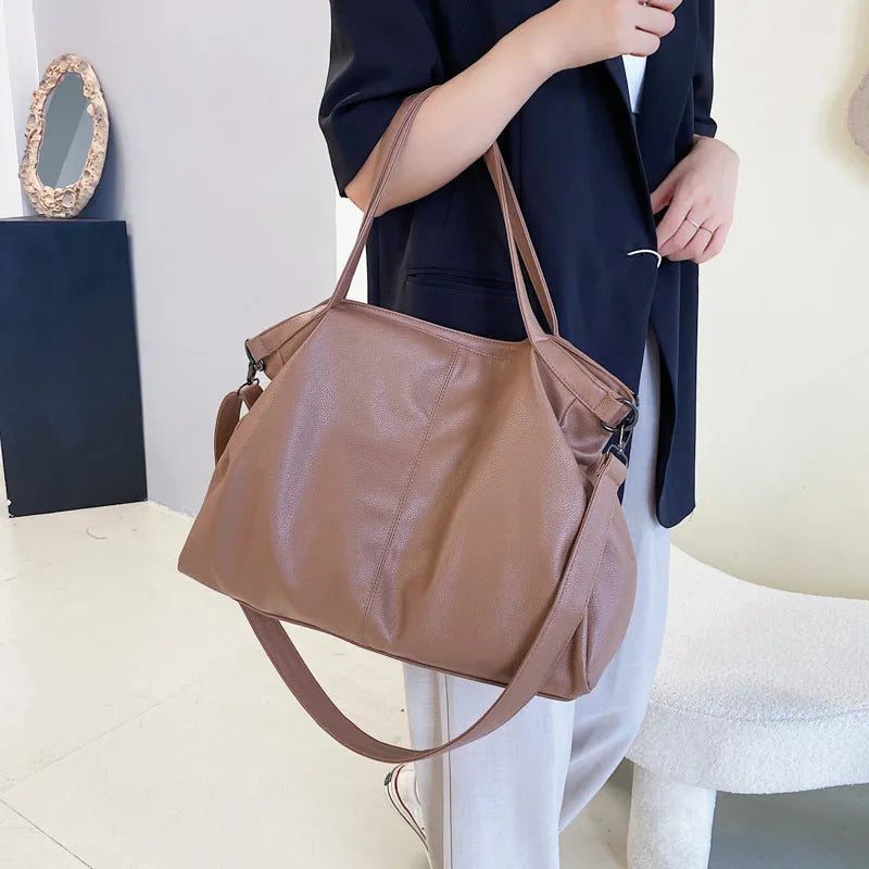 Large soft surface PU tote messenger bag in horizontal square shape with shoulder strap and zipper opening