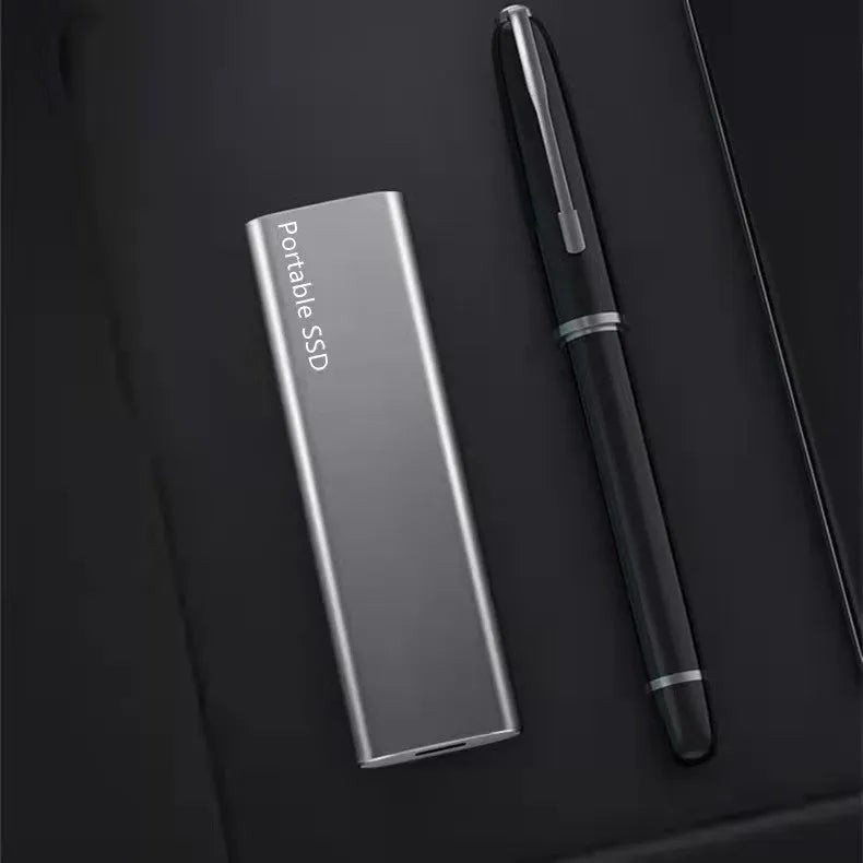 External mobile SSD hard drive with ultra-thin metal casing showing red interface connector