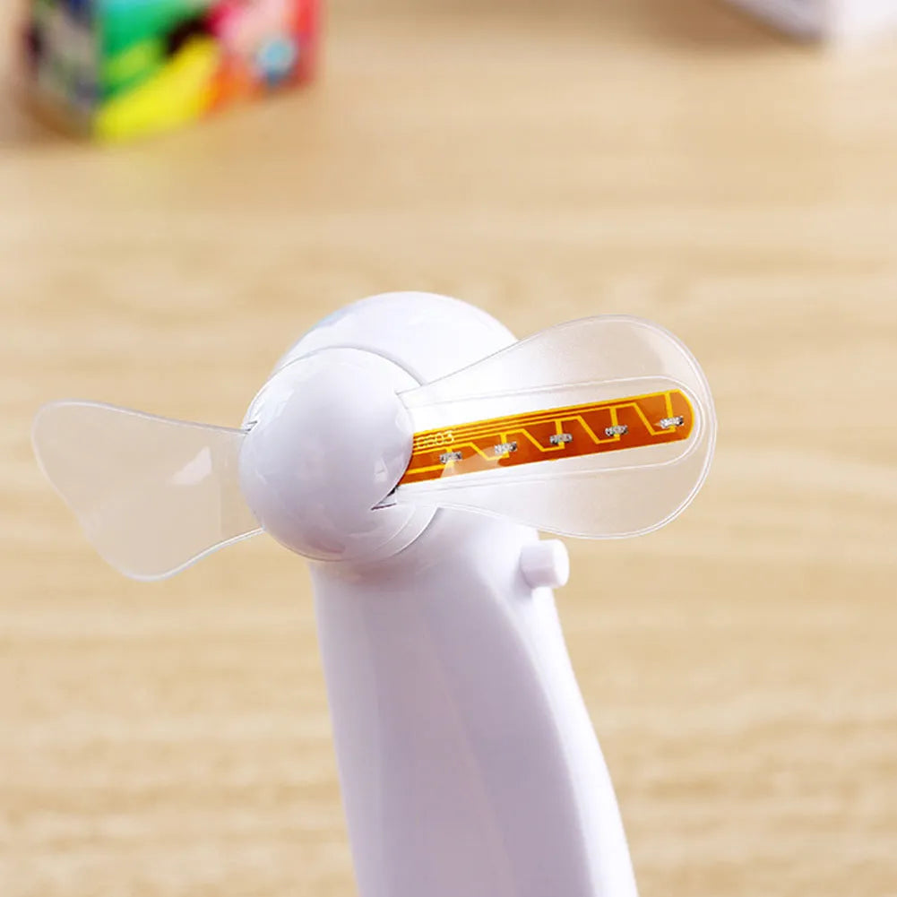 White handheld mini fan with blue and red LED lights spelling 'I love you' on a clear display.