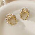 Gold floral basket earrings with pearl inlay detail on rice-shaped beads