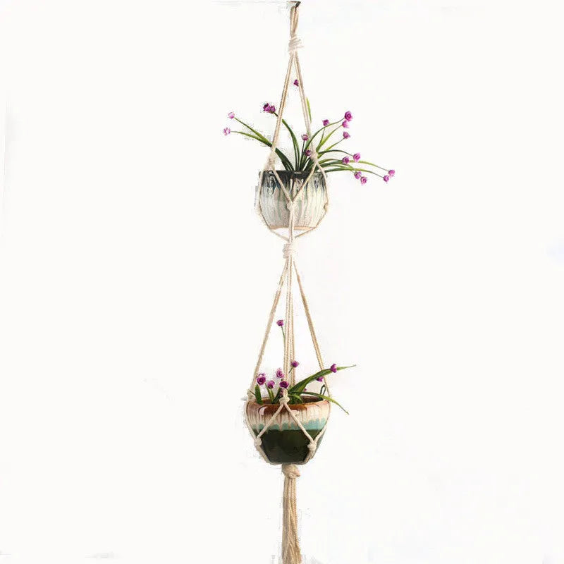 Woven cotton rope plant holder in a rustic style for hanging or tabletop use.