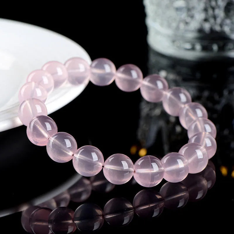 Natural polished crystal round bead bracelet in pink, shown in a single circle configuration with various bead size options.