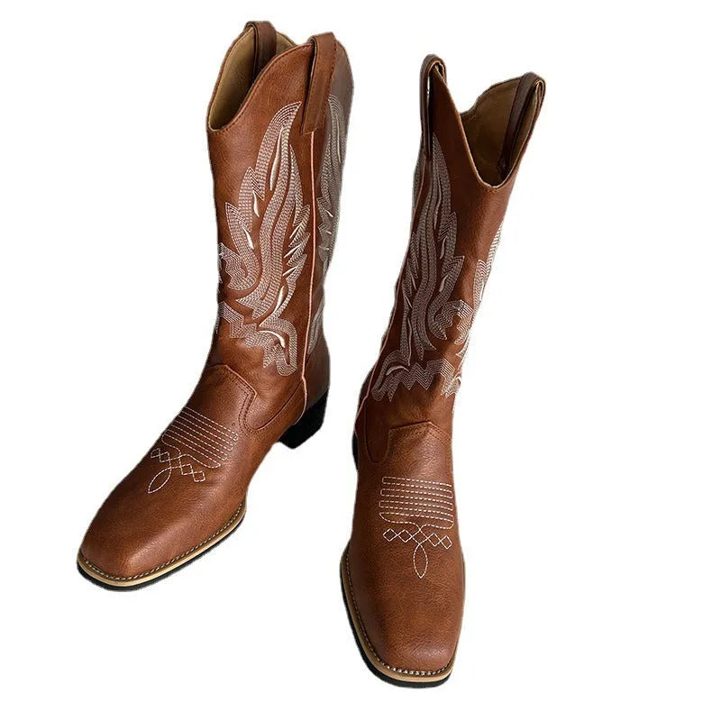 Brown women's embroidered mid-calf Martin boots with a low square heel and round toe.