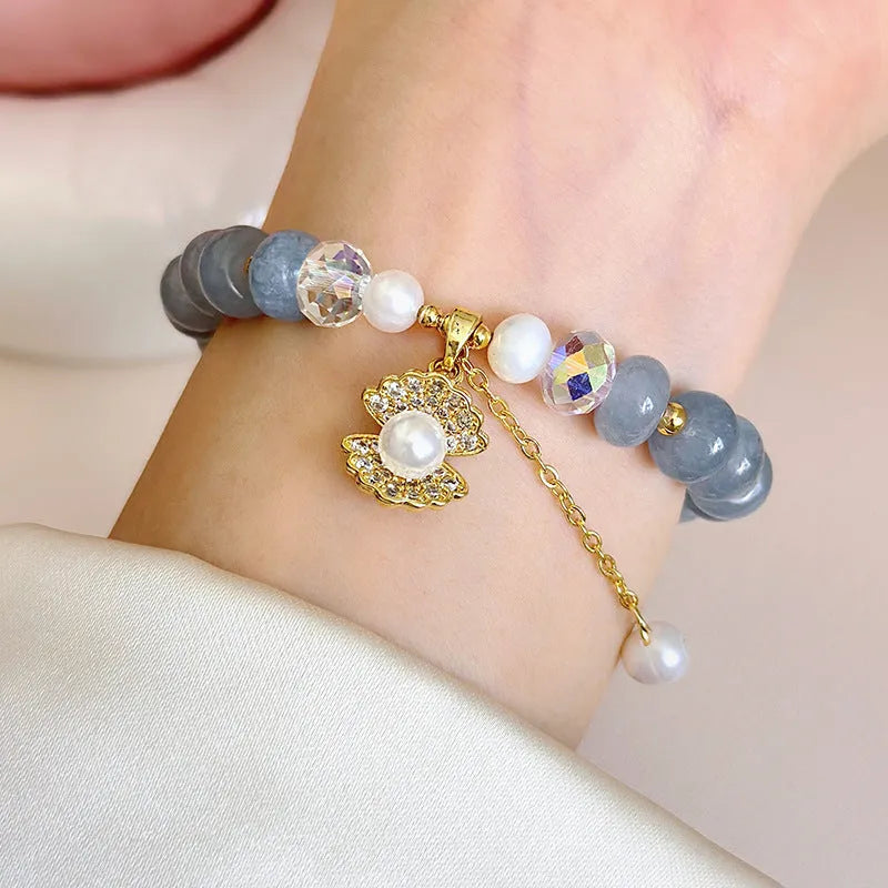 Natural aquamarine pearl and shell bracelet on adjustable stretch cord