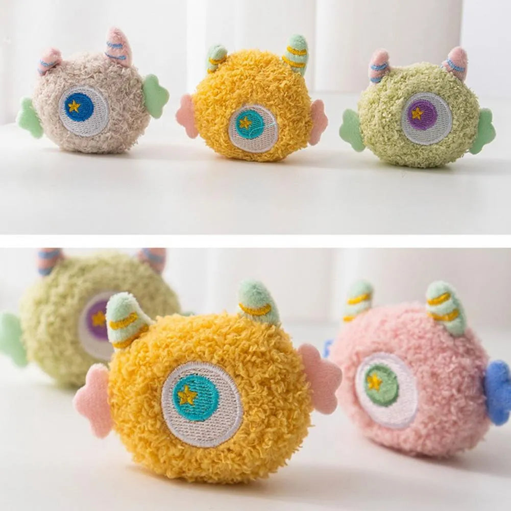 Cartoon-shaped plush dog chew toy with large eyes and squeaker in assorted colours