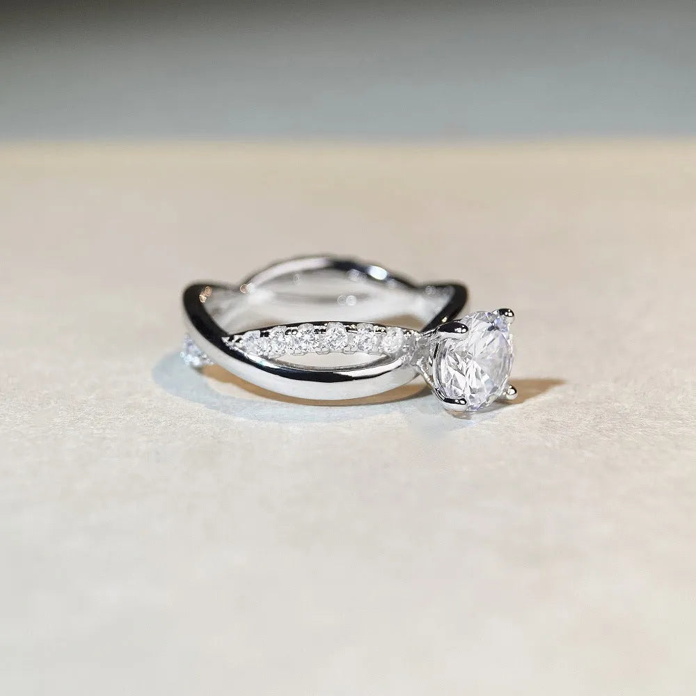 Silver ring with twisted band and 1 carat moissanite stone in four-claw setting
