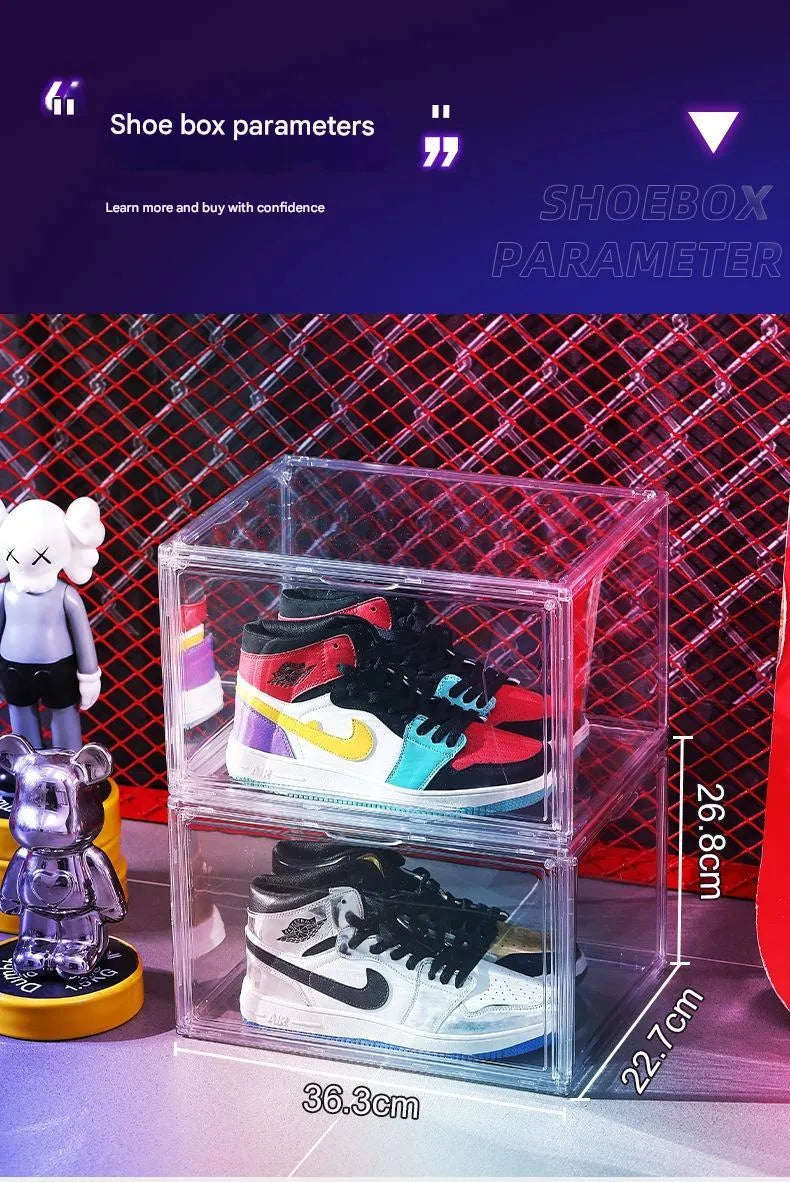 Clear acrylic shoe storage box with magnetic side door open, showing shoes inside.