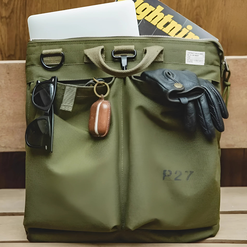 Military green canvas crossbody messenger bag with shoulder strap showing vertical square shape and zipper closure