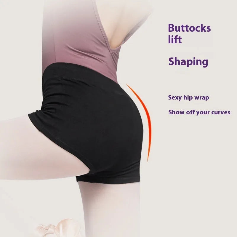 Black women's cotton dance practice shorts laid flat, showing solid colour and simple design.