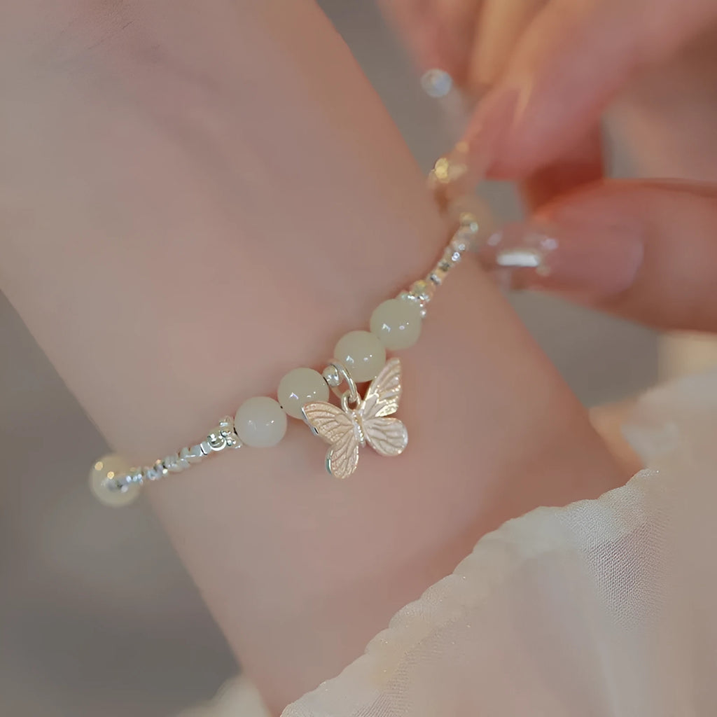 Women's butterfly jewellery set with bracelet and necklace featuring silver electroplated finish and Hetian jade details