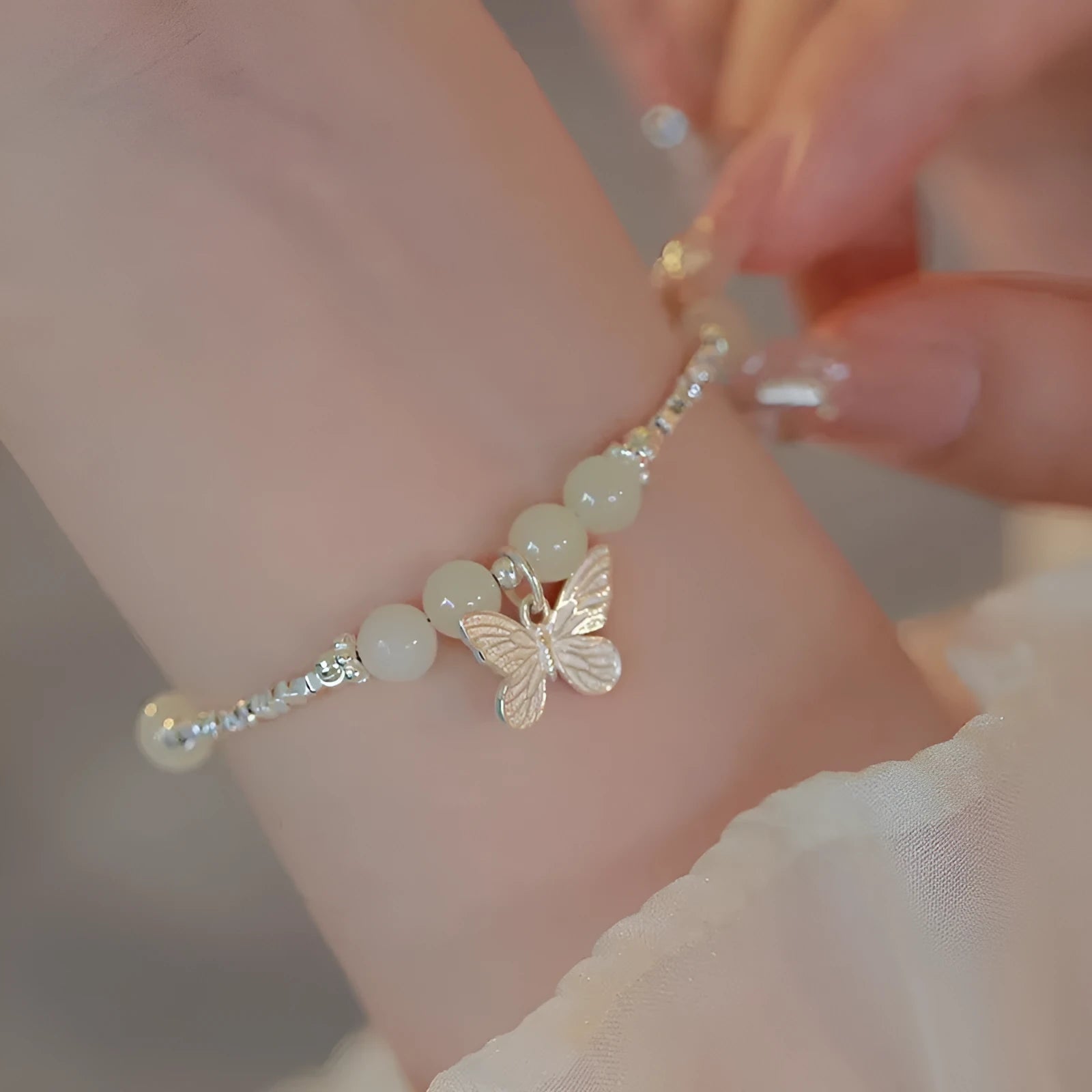 Women's butterfly jewellery set with bracelet and necklace featuring silver electroplated finish and Hetian jade details