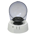 Small white mini laboratory centrifuge unit on a benchtop.
