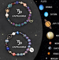 Set of two natural stone beaded bracelets showing different Chinese Zodiac sign designs.