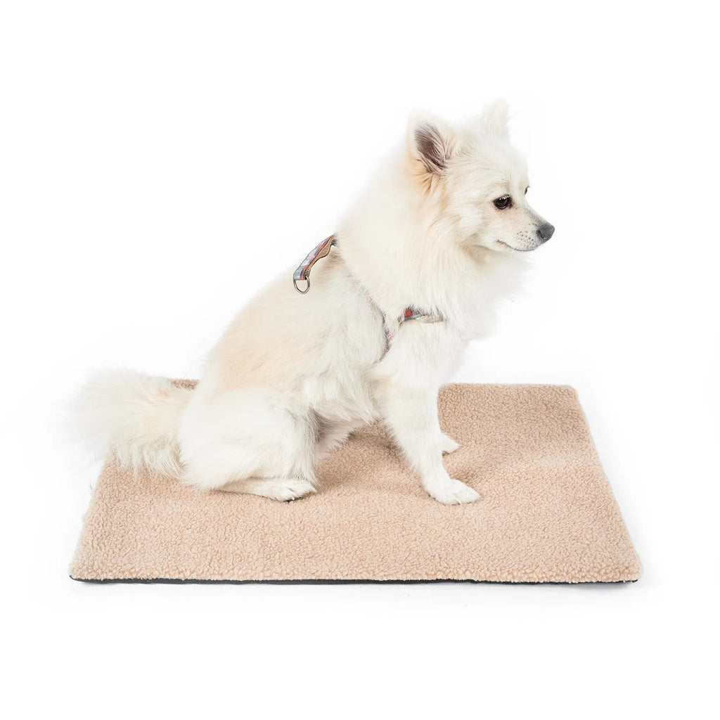 Grey self-heating pet pad for cats on floor next to measuring tape showing 95cm length