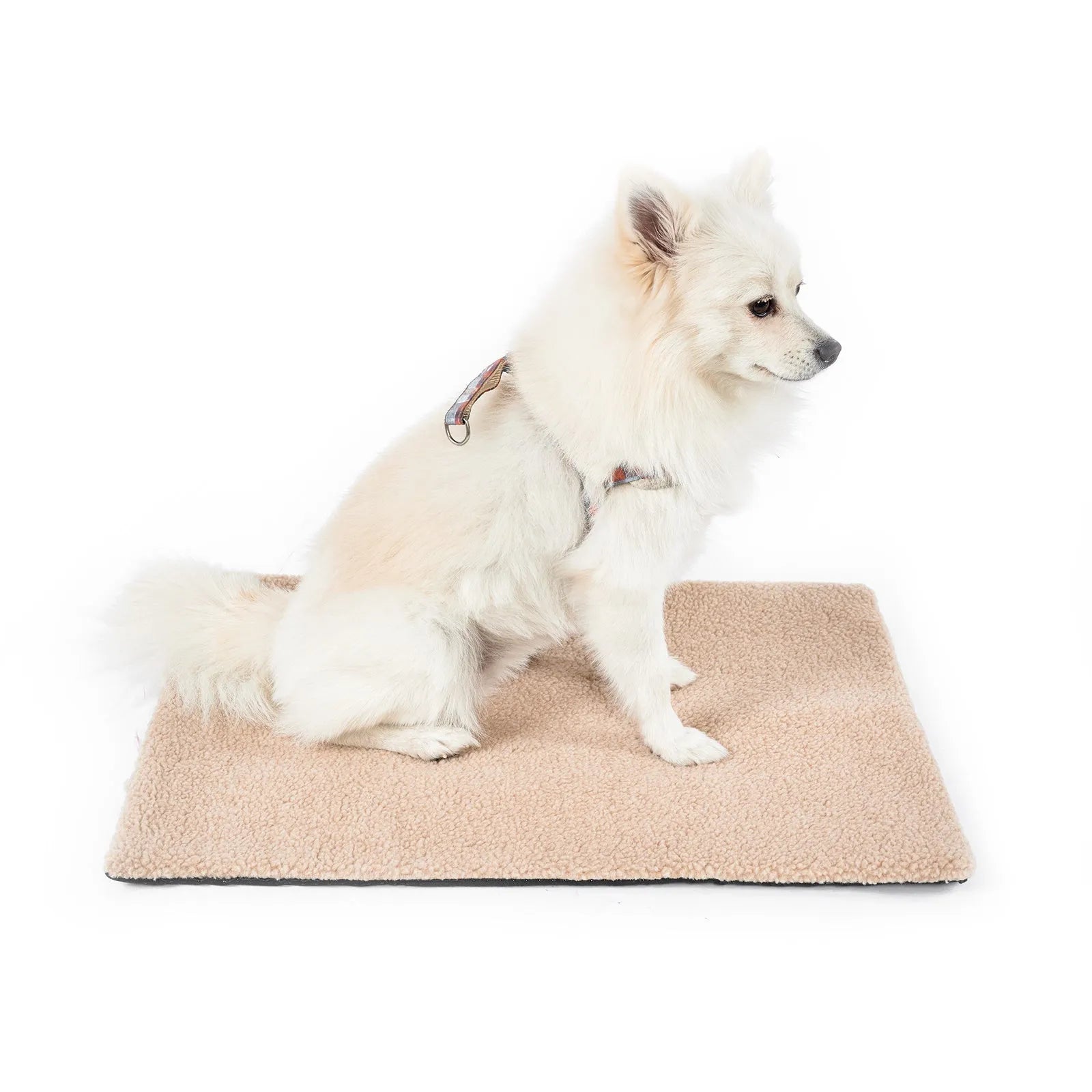 Grey self-heating pet pad for cats on floor next to measuring tape showing 95cm length