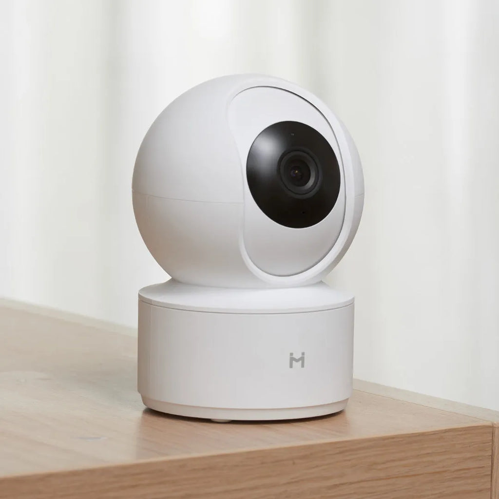 White Xiaobai Smart Camera indoor security unit showing lens and compact design.