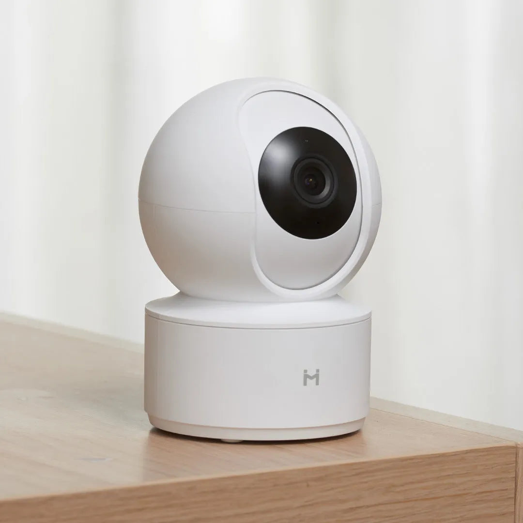 White Xiaobai Smart Camera indoor security unit showing lens and compact design.