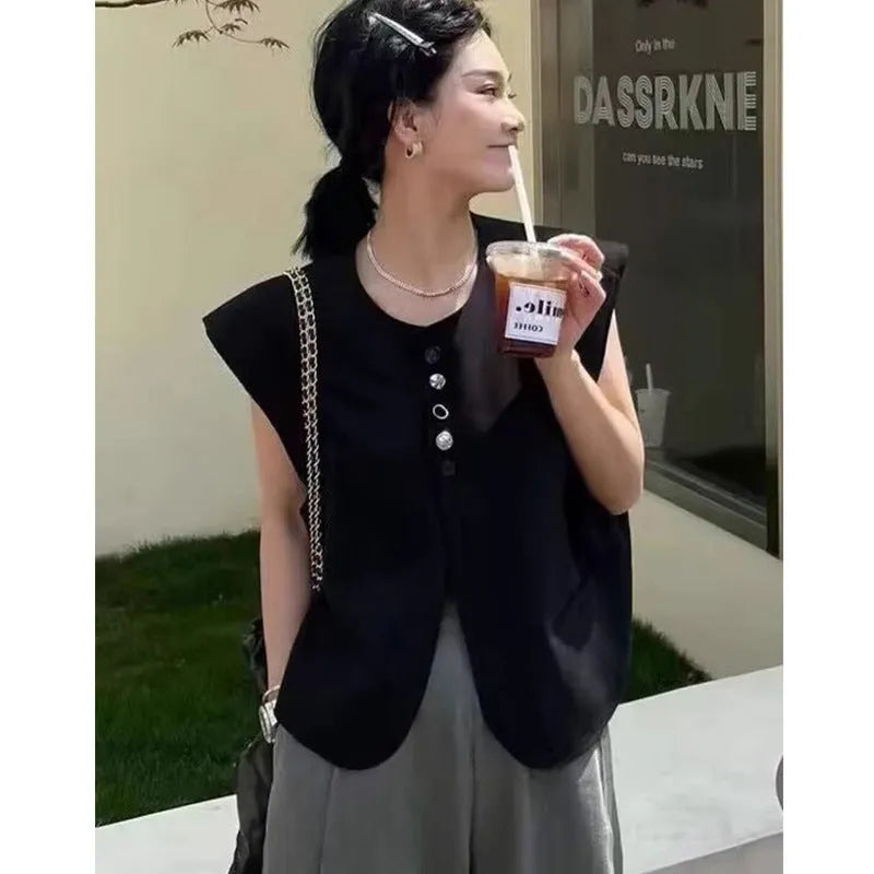 Women's loose fit solid colour polyester vest with pockets in milk white.