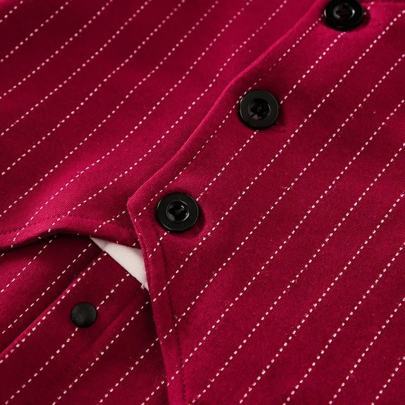 Baby boy wearing a wine red long-sleeved gentleman-style cotton jumpsuit with single-breasted closure.